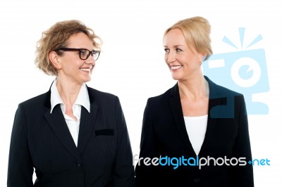 Aged Corporate Women Looking At Each Other Stock Photo