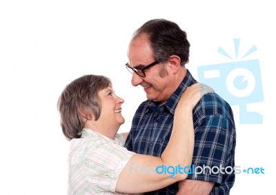 Aged Couple In Romantic Mood Stock Photo