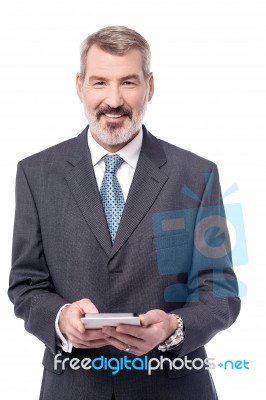 Aged Entrepreneur Holding Tablet Pc Stock Photo