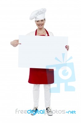 Aged Lady Cook Pointing Blank Board Stock Photo