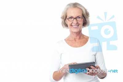 Aged Lady Operating Touch Pad Device Stock Photo