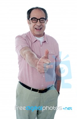 Aged Male Gesturing Thumbs Up Stock Photo