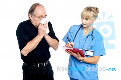 Aged Male Suffering From Cold, Sneezing Stock Photo