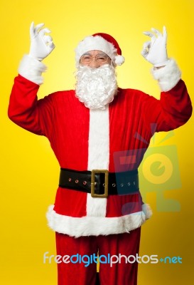 Aged Santa Gesturing Perfect Sign With Both Hands Stock Photo