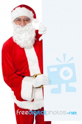 Aged Santa Holding Blank White Banner Ad Board Stock Photo