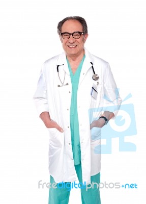 Aged Surgeon With Hand In Pocket Stock Photo