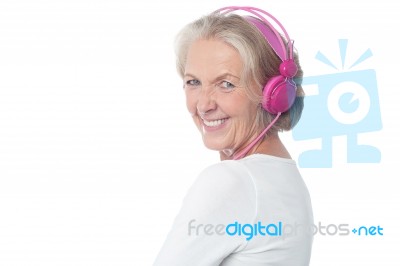 Aged Woman Enjoying Today's Music Stock Photo