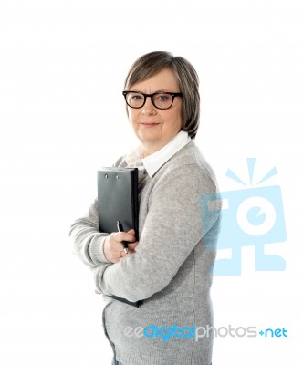 Aged Woman Holding File Stock Photo