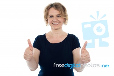 Aged Woman Showing Thumbs Up Stock Photo