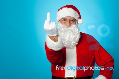 Agitated Santa Showing His Middle Finger Stock Photo