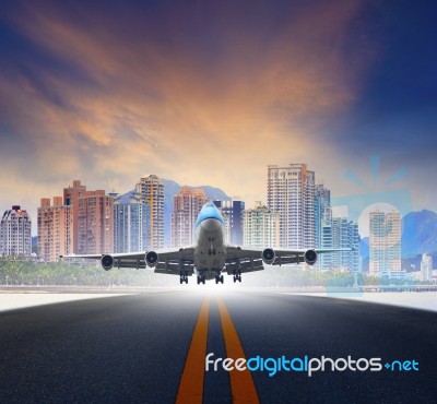 Air Plane Landing In Town Airport Stock Photo