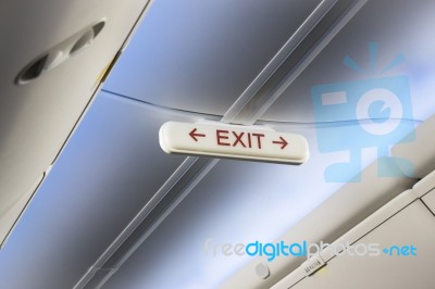 Airplane Cabin Interior Exit Sign Stock Photo