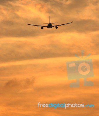 Airplane Flying In Sky Stock Photo