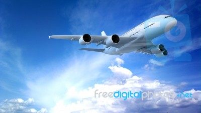 Airplane Flying In The Blue Sky Stock Photo