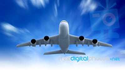 Airplane Flying In The Blue Sky Stock Photo