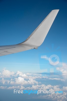 Airplane Wing And Sky Stock Photo