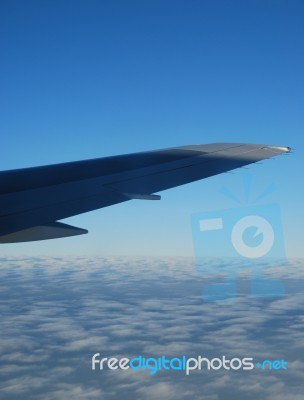 Airplane Wing View With Gorgeous Clouscape Stock Photo