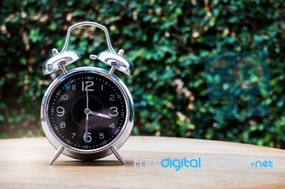 Alarm Clock On Wooden Background Stock Photo