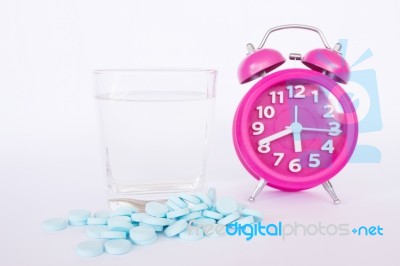 Alarm Clock ,pills And Glass Of Water Stock Photo