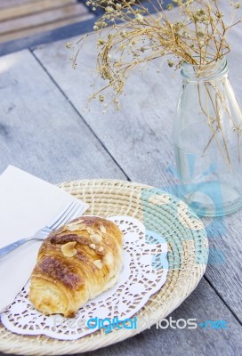 Almond Croissant On Wood Table Stock Photo