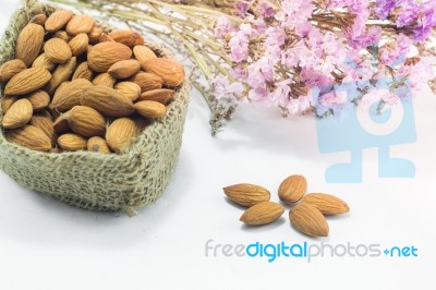 Almond Grains On White Clean Table Stock Photo