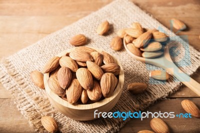 Almond In Wooden Bowl On Table Stock Photo