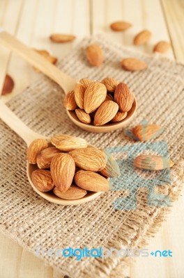 Almond In Wooden Spoon Stock Photo