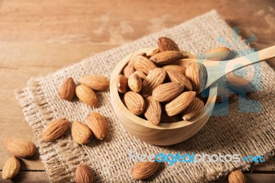 Almond In Wooden Spoon On Table Stock Photo