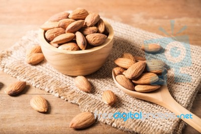 Almond In Wooden Spoon On Table Stock Photo