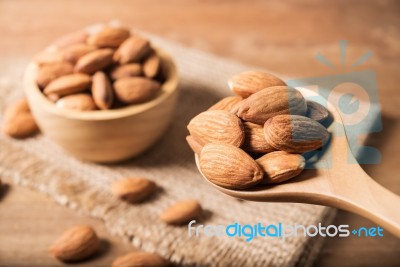 Almond In Wooden Spoon On Table Stock Photo