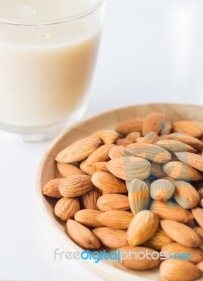 Almond Milk And Grain On White Kitchen Table Stock Photo