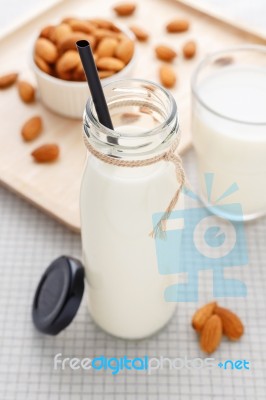 Almond Milk Bottle With Straw Stock Photo