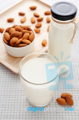 Almond Milk In Glass And Bottle Stock Photo