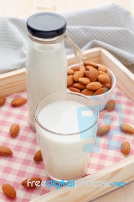 Almond Milk In Glass And Bottle With Almonds Stock Photo