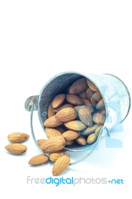 Almonds In Bucket Isolated On White Background Stock Photo