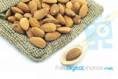 Almonds In Sack Isolated On White Background Stock Photo