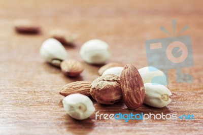 Almonds On Wooden Floor Stock Photo