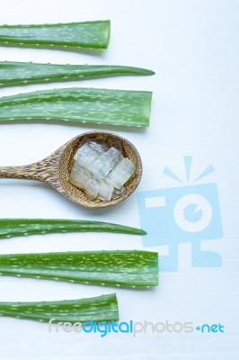 Aloe Vera Fresh Leaves With  Aloe Vera Gel On Wooden Spoon Stock Photo