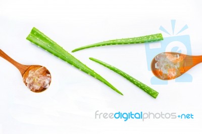 Aloe Vera Fresh Leaves With Aloe Vera Gel On Wooden Spoon Stock Photo