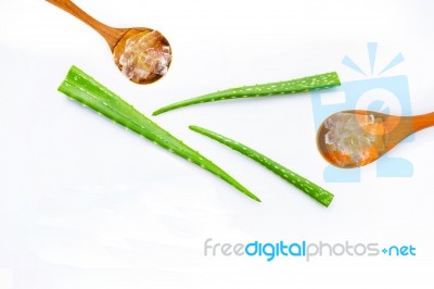 Aloe Vera Fresh Leaves With Aloe Vera Gel On Wooden Spoon Stock Photo