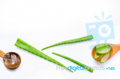 Aloe Vera Fresh Leaves With Aloe Vera Gel On Wooden Spoon Stock Photo