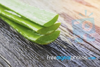 Aloe Vera Leaves On Wooden Stock Photo