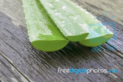 Aloe Vera Leaves On Wooden Stock Photo