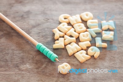 Alphabet Biscuit On Wooden Table Stock Photo