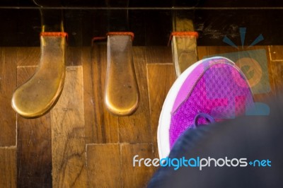 Amateur Pianist Press On Foot Pedals Of Antique Piano Stock Photo