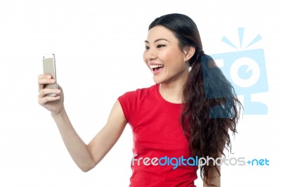 Amused Girl Clicking A Selfie Stock Photo