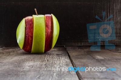 An Apple Surrounded By A Measuring Tape Tailor On Wood Stock Photo