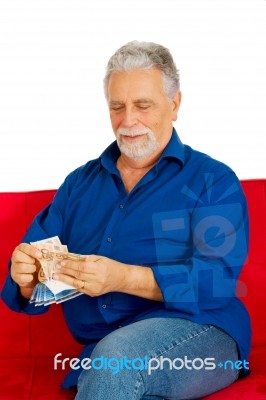 An Old Man Holding Money Stock Photo