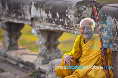 An Unidentified Old Buddhist Female Monk Dressed In Orange Toga Stock Photo