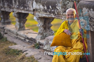 An Unidentified Old Buddhist Female Monk Dressed In Orange Toga Stock Photo